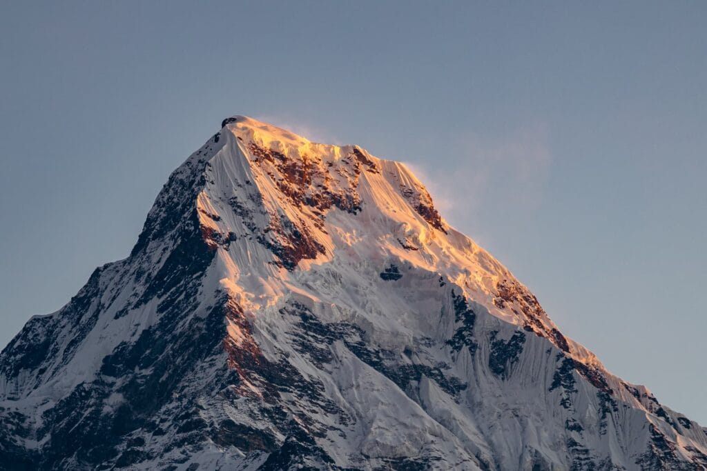 Sunrise over the Himalayan peaks with golden light on the mountains