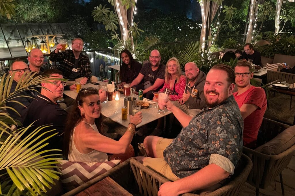 Travelers gathered around a table for dinner during a group tour